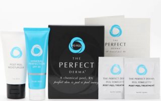 A set of The Perfect Derma chemical peel products, including a moisturizer, SPF 30 cream, a black product box, treatment towelettes, and an instruction booklet, all with blue and white packaging.